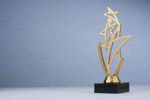 Golden triple tar shaped trophy for rewarding